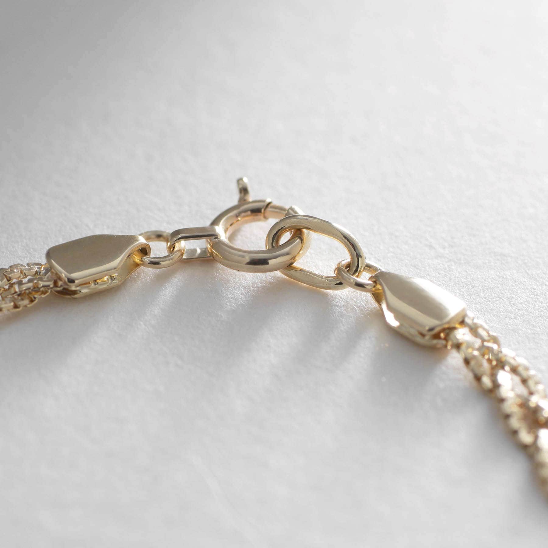 ココシュニック COCOSHNIK K10ベネフラット三つ編み ブレスレット イエローゴールド(100)