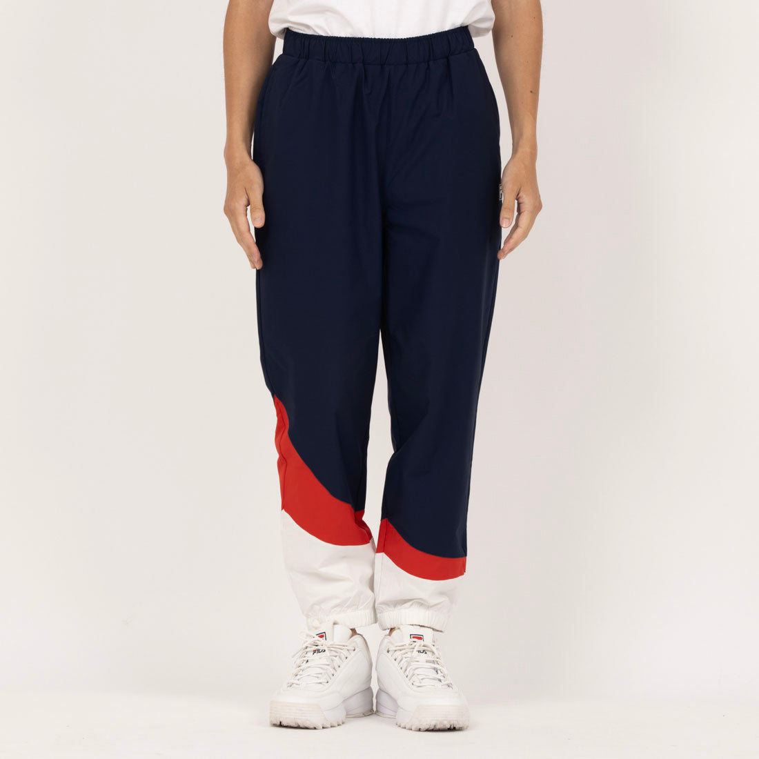 フィラ FILA 【IMP.佐藤新さん着用】WIND TRACK PANTS / ウィンドトラックパンツ / メンズ (ネイビー) ネイビー