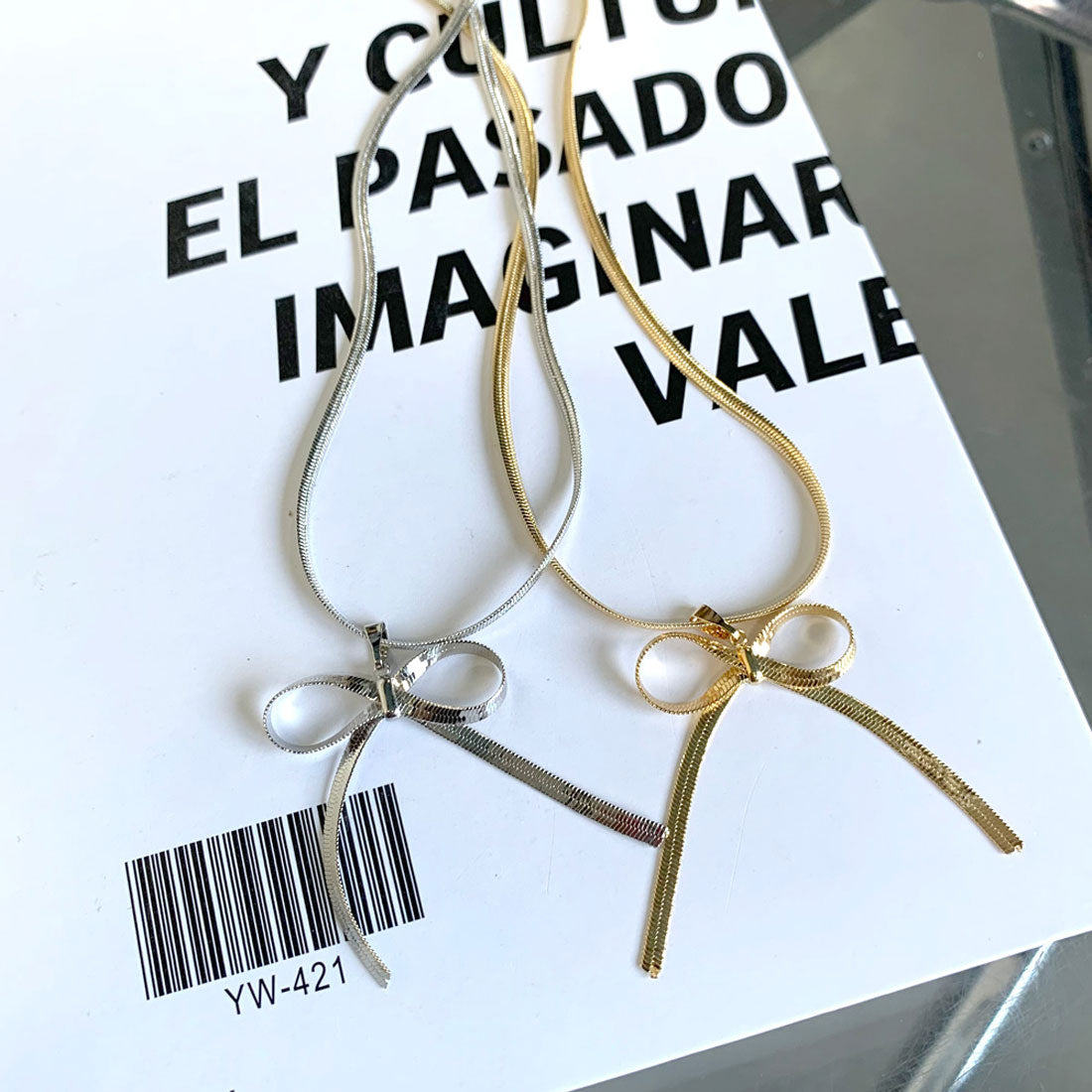 ノンヘッジ non-hedge チェーンリボンネックレス (ゴールド) ゴールド