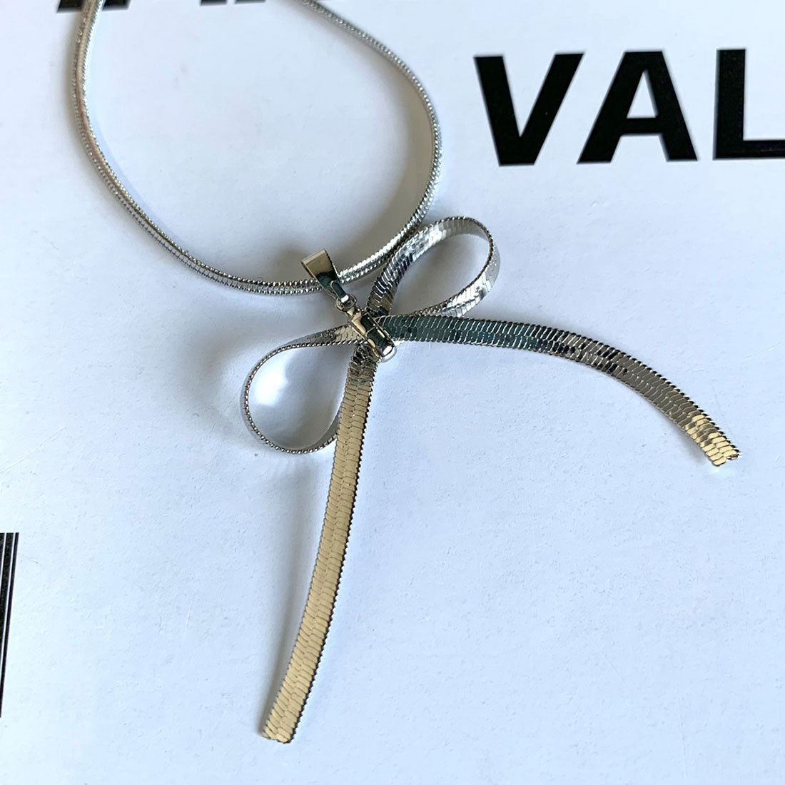 ノンヘッジ non-hedge チェーンリボンネックレス (ゴールド) ゴールド