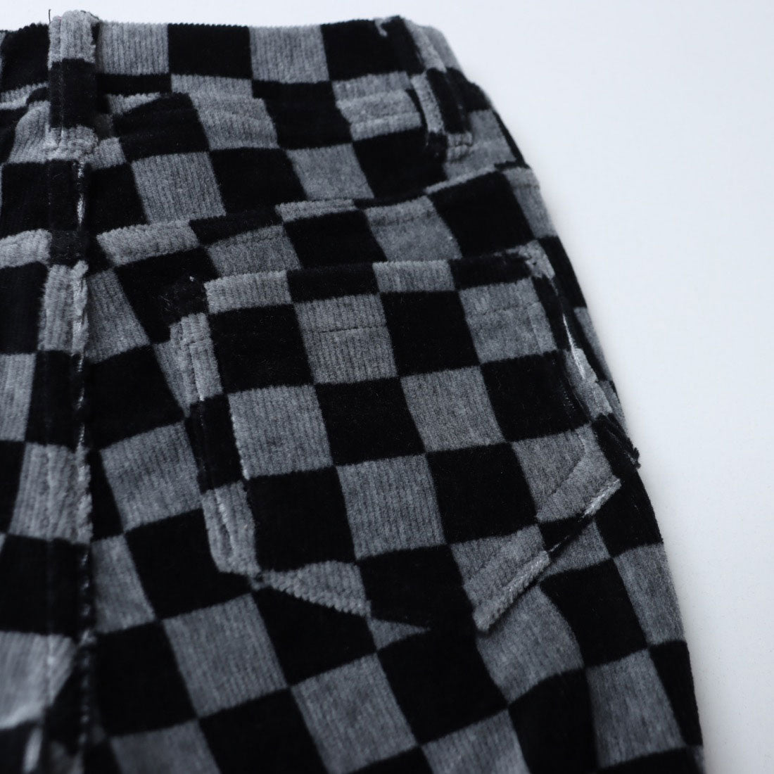 United Colors of Benetton. Kids' block check pants with decorative buttons and fleece.