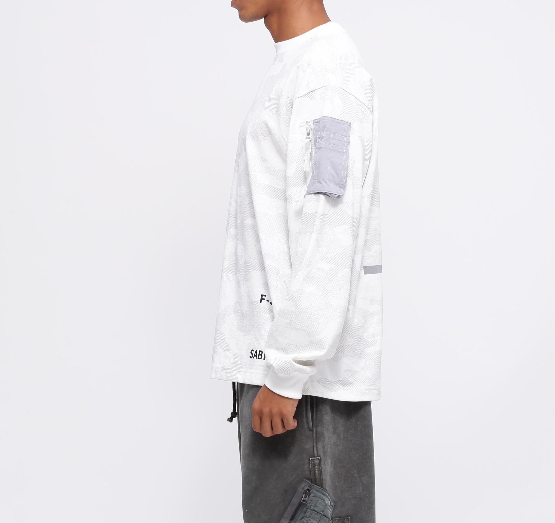 SIDE ZIP STENCIL T-SHI>T "HAT IN THE >ING" / サイドジップ ステンシル 長袖Tシャツ "ハット  ホワイトカモ34