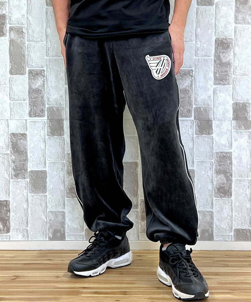 アヴィレックス AVIREX アヴィレックス VELOUR PANTS 'A.C.D' ベロア パンツ ジャージ サイドライン 刺繍 ロングパンツ イージーパンツ メンズ （ブラック） ブラック
