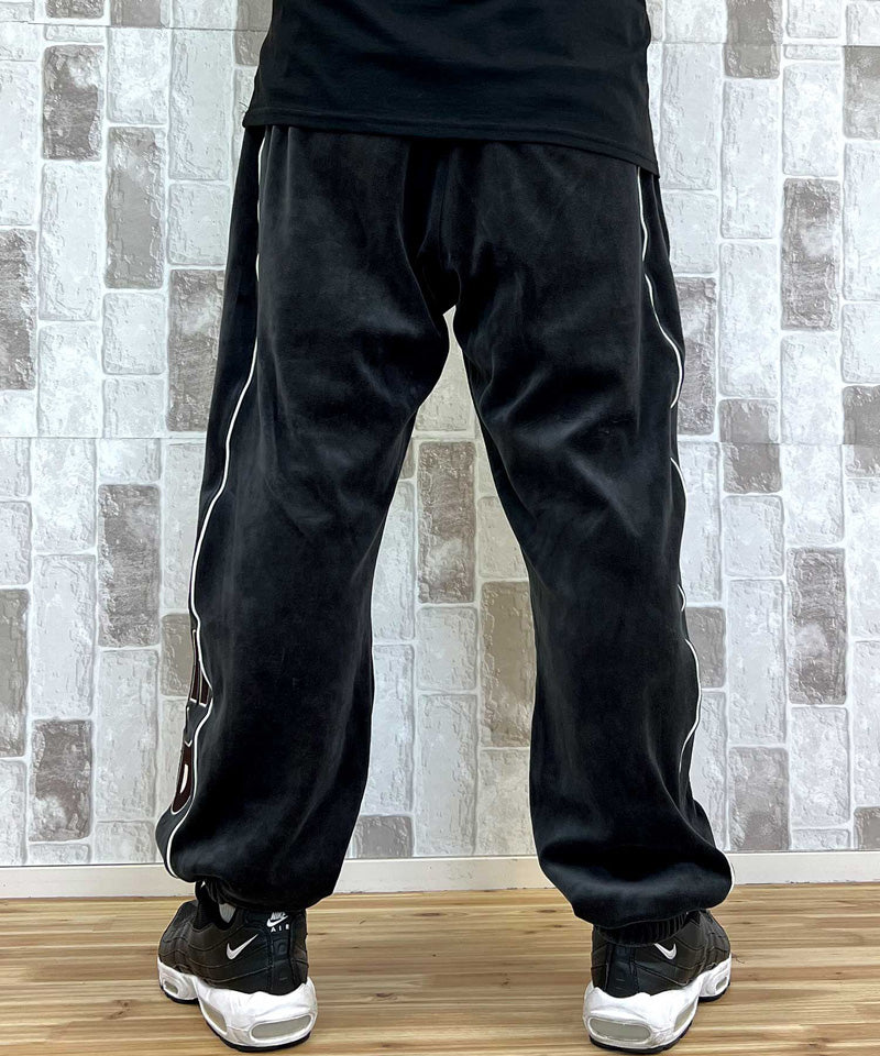 アヴィレックス AVIREX アヴィレックス VELOUR PANTS 'A.C.D' ベロア パンツ ジャージ サイドライン 刺繍 ロングパンツ イージーパンツ メンズ （ブラック） ブラック