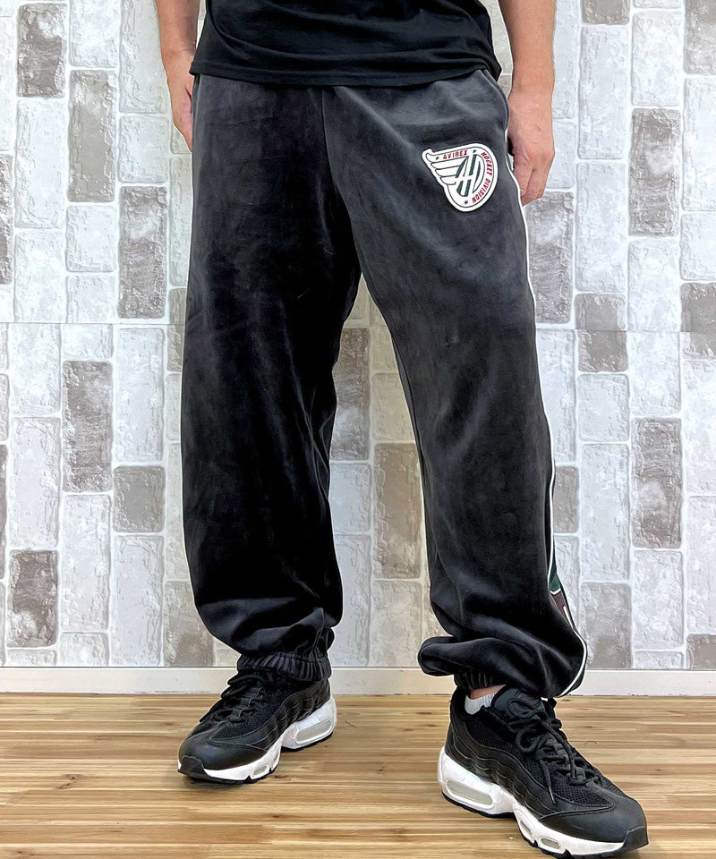 アヴィレックス AVIREX アヴィレックス VELOUR PANTS 'A.C.D' ベロア パンツ ジャージ サイドライン 刺繍 ロングパンツ イージーパンツ メンズ （ブラック） ブラック