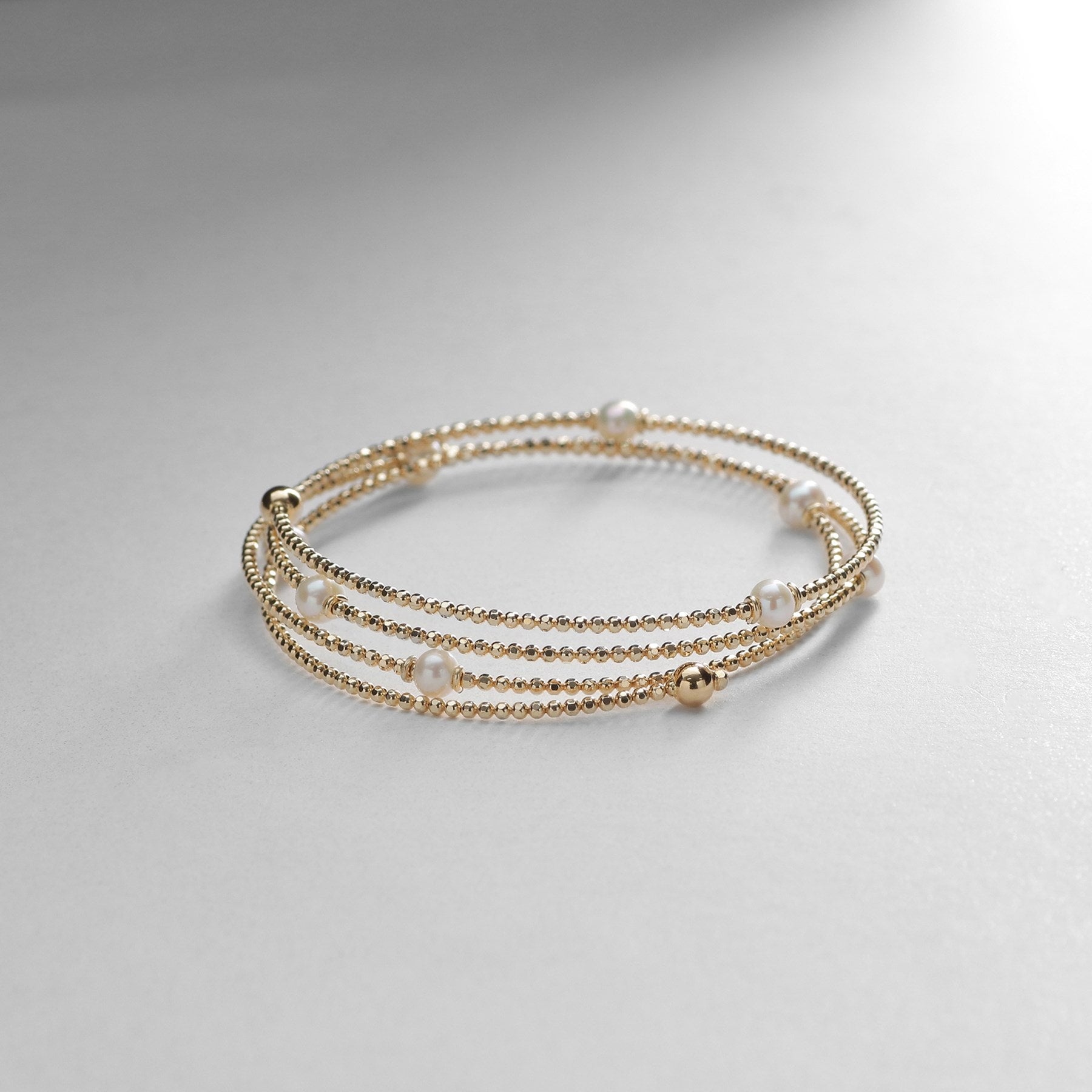 ココシュニック COCOSHNIK K10パール 形状記憶バングル イエローゴールド(106)