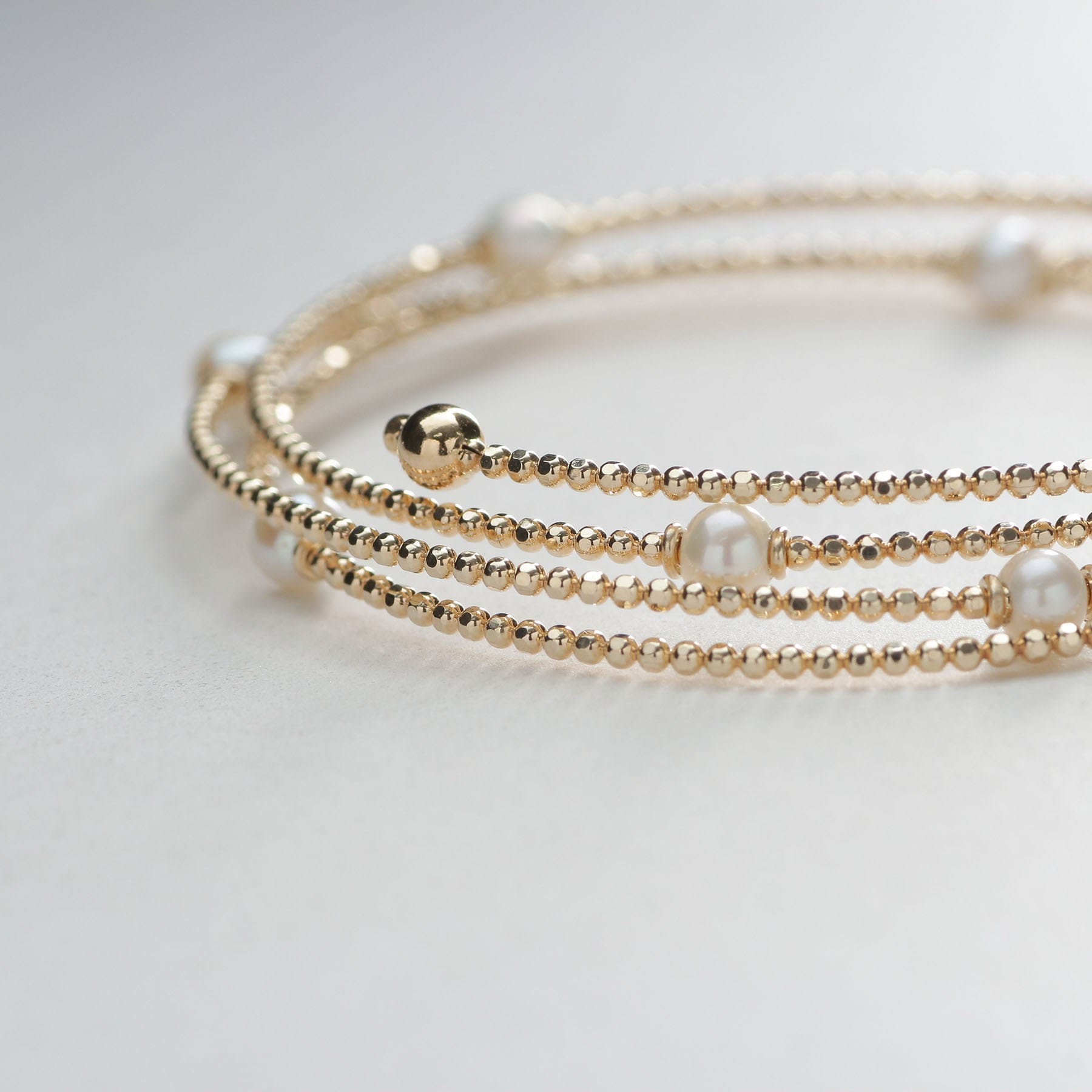 ココシュニック COCOSHNIK K10パール 形状記憶バングル イエローゴールド(106)