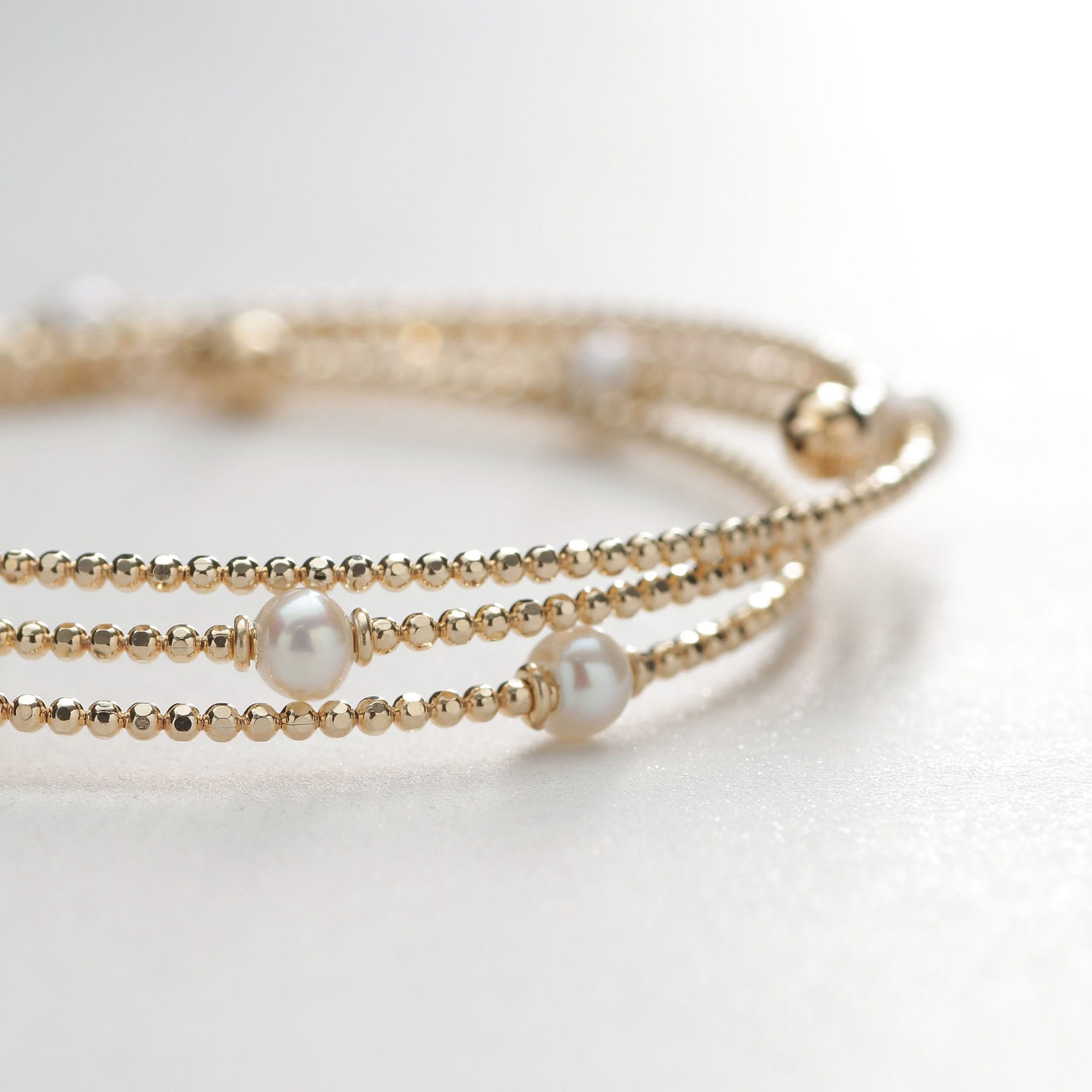 ココシュニック COCOSHNIK K10パール 形状記憶バングル イエローゴールド(106)