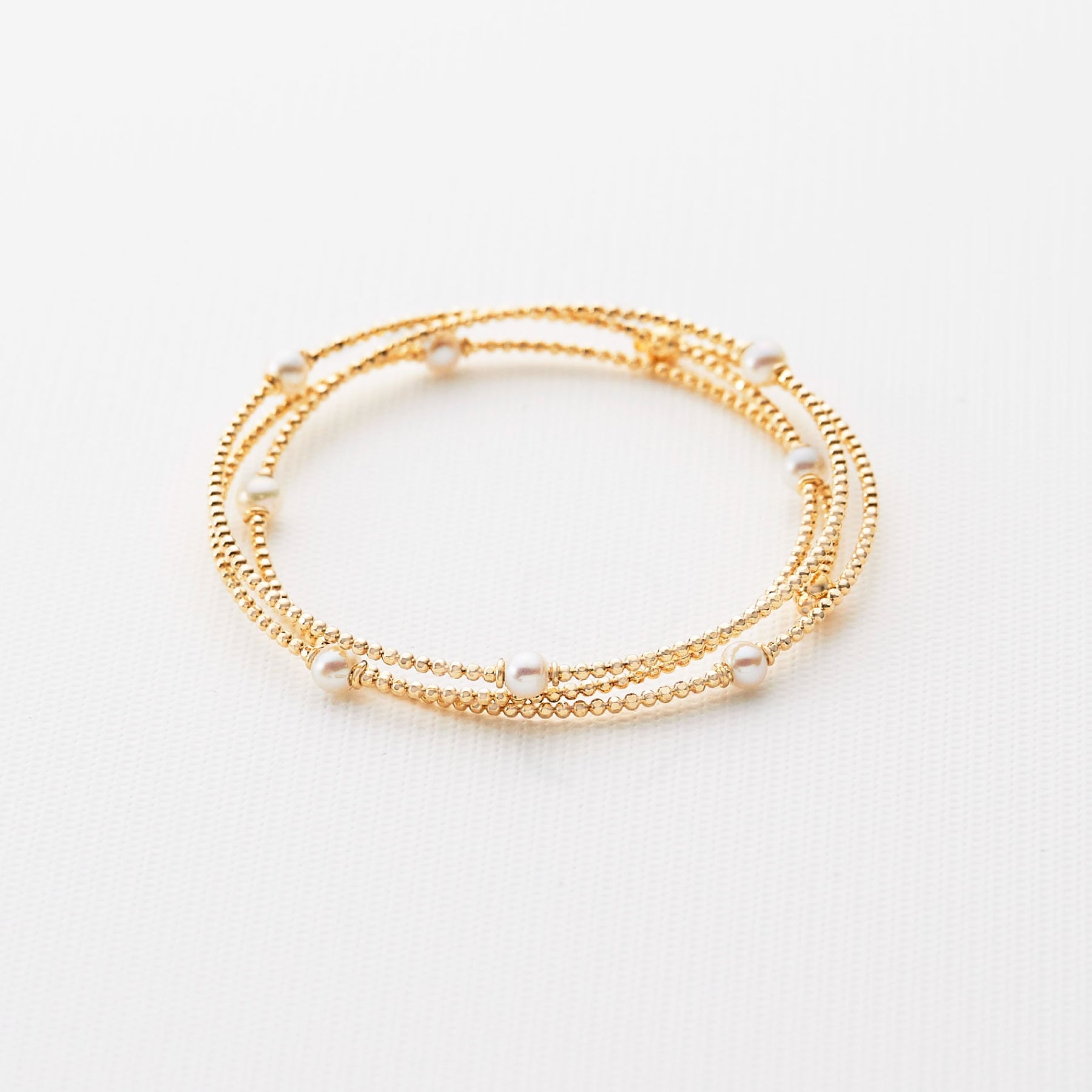 ココシュニック COCOSHNIK K10パール 形状記憶バングル イエローゴールド(106)