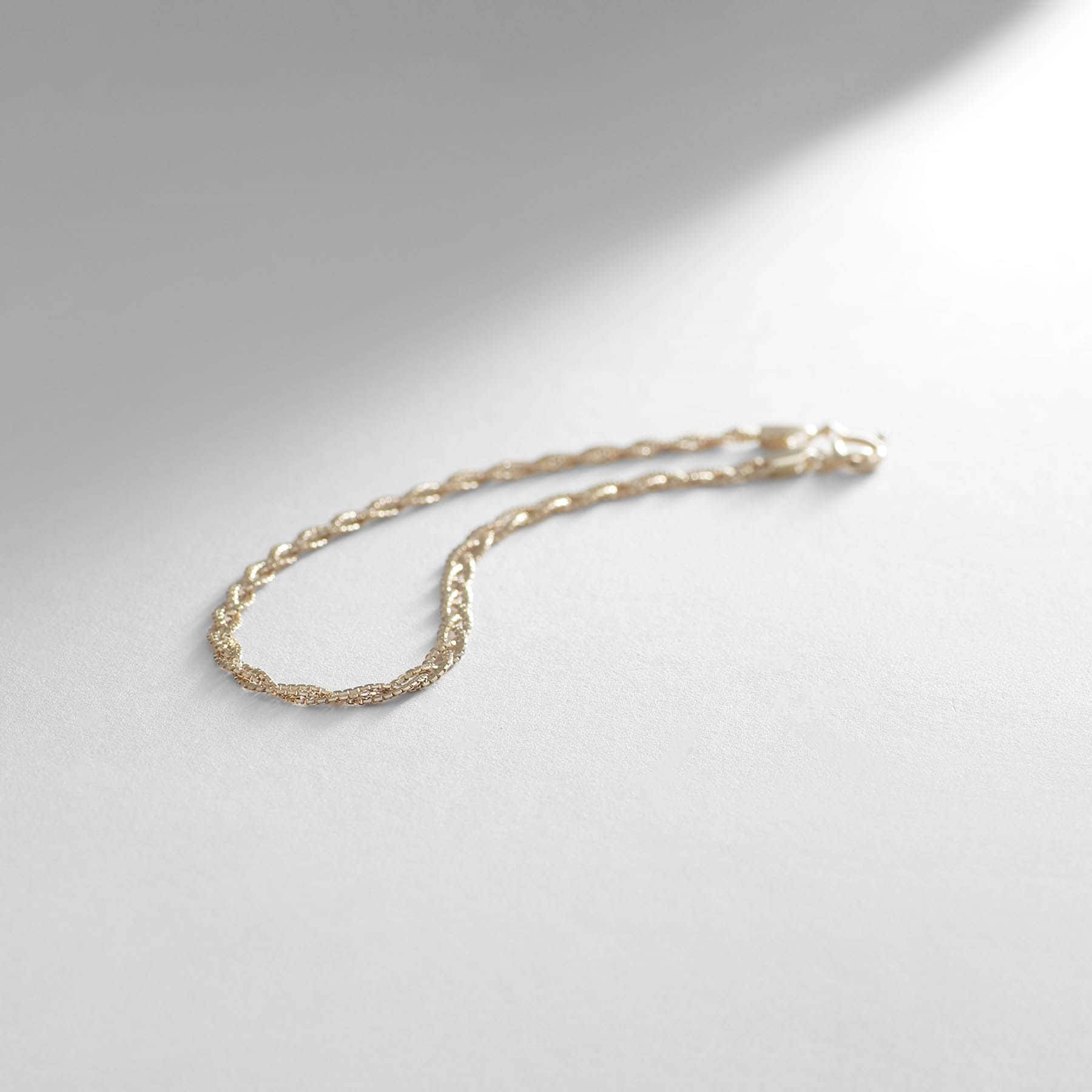 ココシュニック COCOSHNIK K10ベネフラット三つ編み ブレスレット イエローゴールド(100)