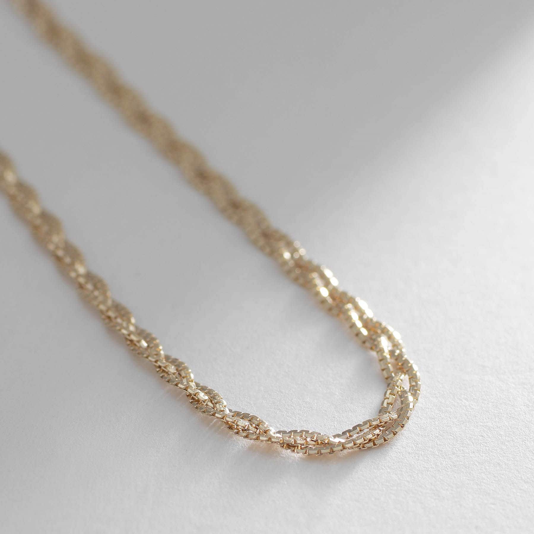 ココシュニック COCOSHNIK K10ベネフラット三つ編み ブレスレット イエローゴールド(100)