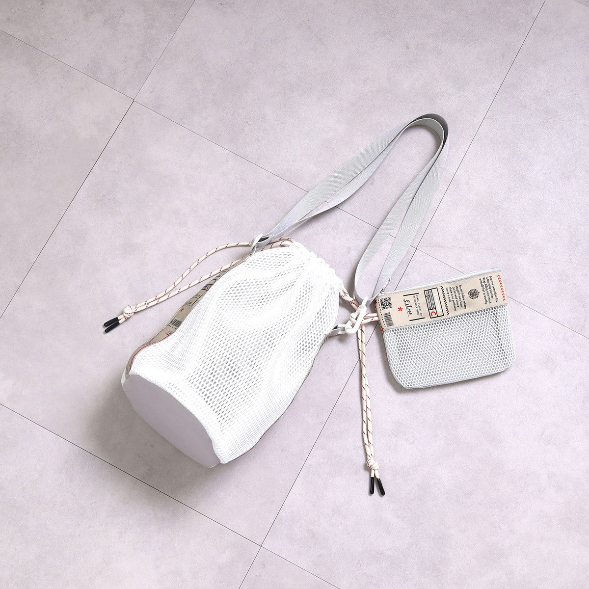クーコ COOCO ロゴテープメッシュ巾着ショルダーバッグ