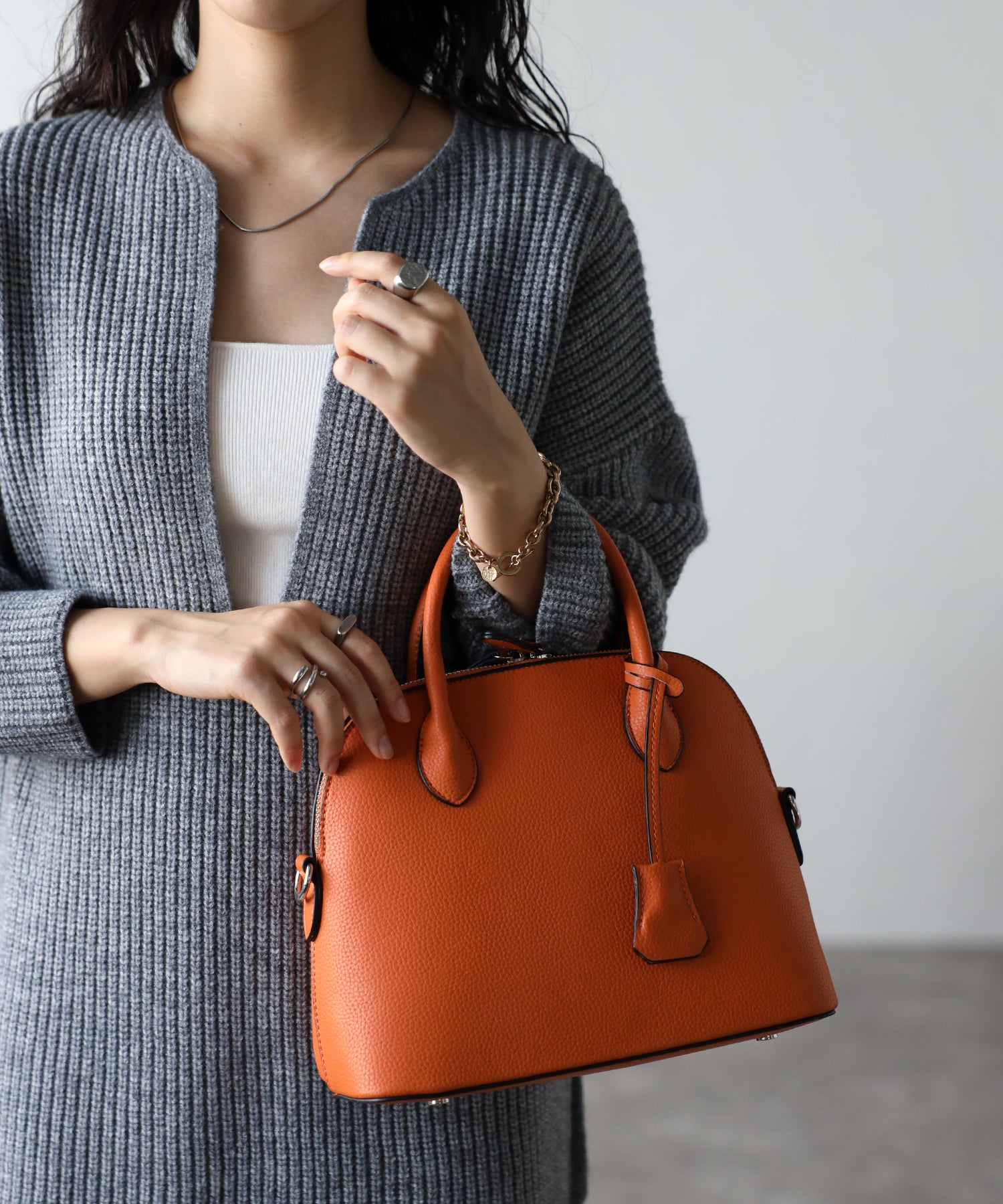 グッシオ GUSCIO 牛革ラウンドミニボストン （ORANGE） ORANGE