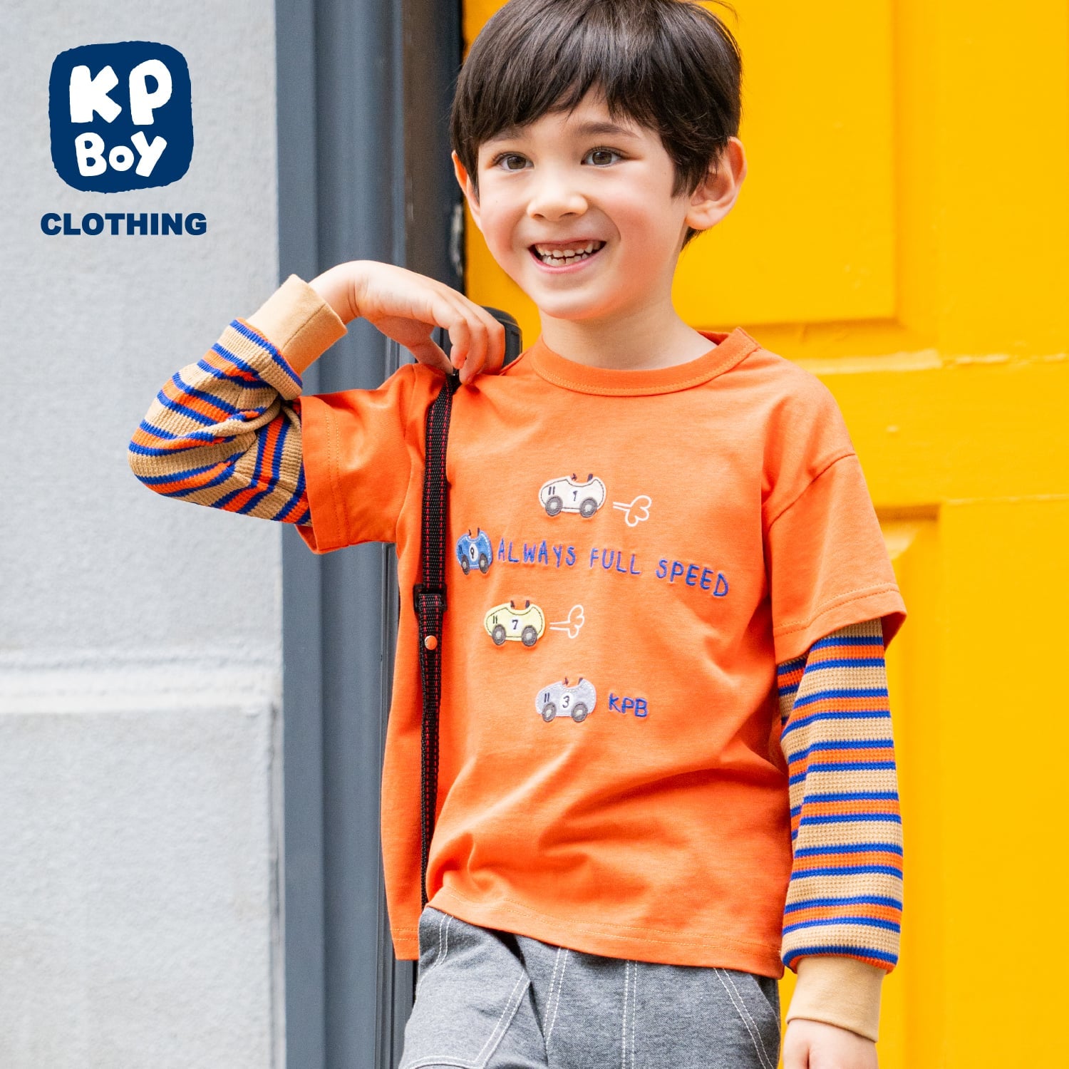 ケーピー KP 車アップリケ レイヤード風長袖Tシャツ （オレンジ） オレンジ