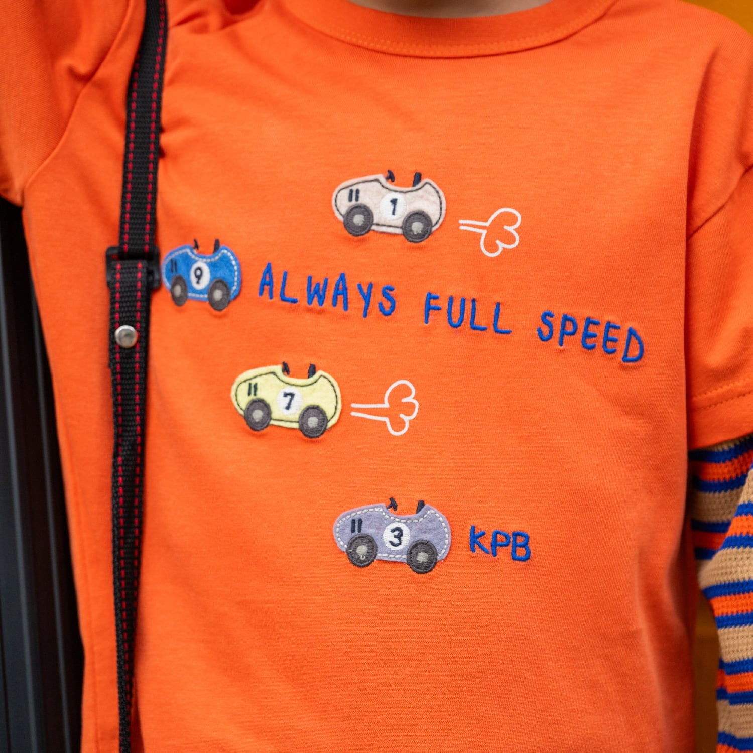 ケーピー KP 車アップリケ レイヤード風長袖Tシャツ （オレンジ） オレンジ