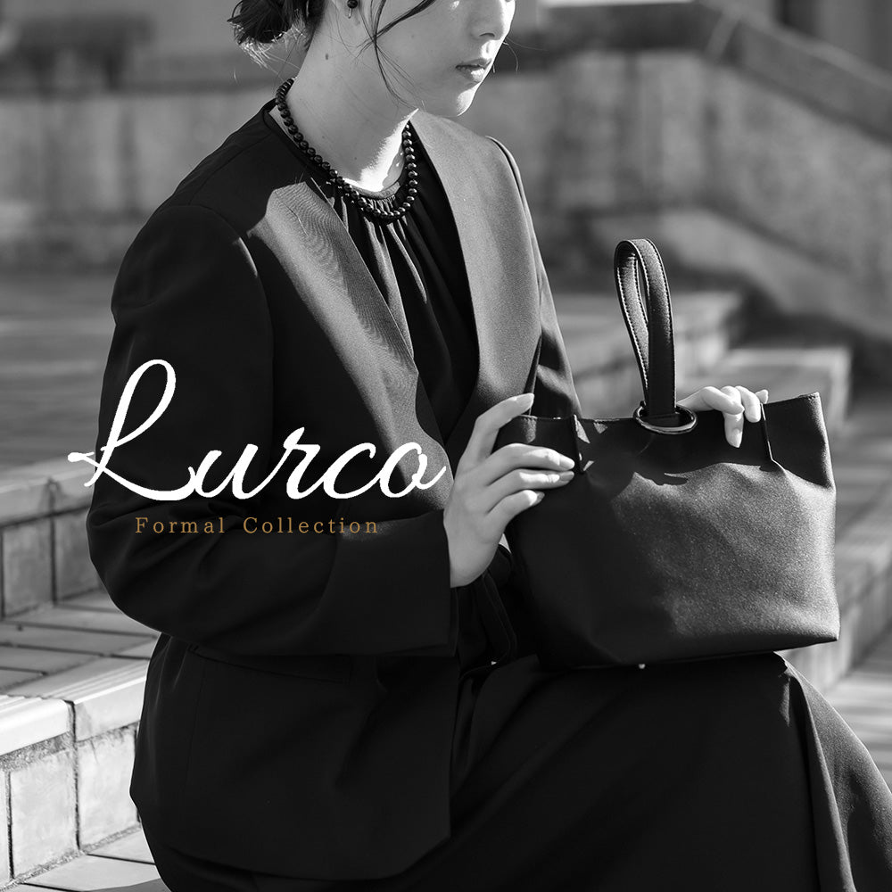ルルコ Lurco 存在感あるタックデザインのワンハンドルフォーマルソフトバッグ （ブラック） ブラック