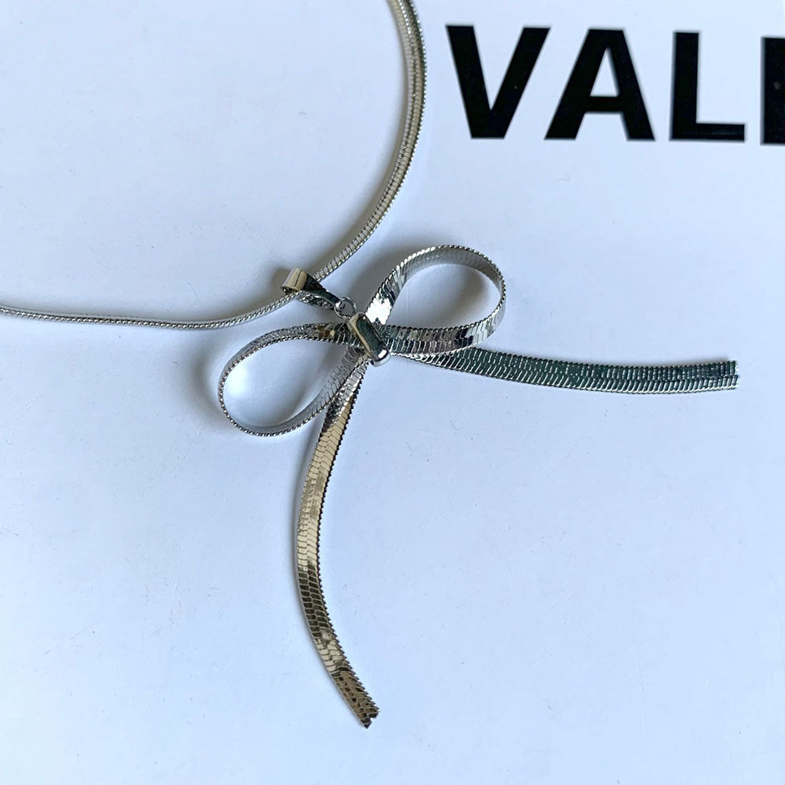 ノンヘッジ non-hedge チェーンリボンネックレス （ゴールド） ゴールド