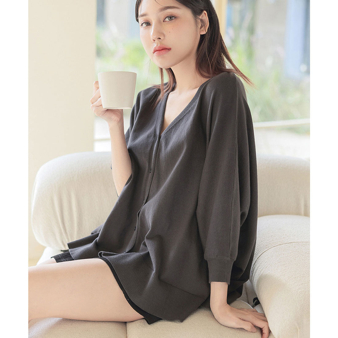"Tu-Hacci nursing cape cardigan that can also be used as a nursing cover."