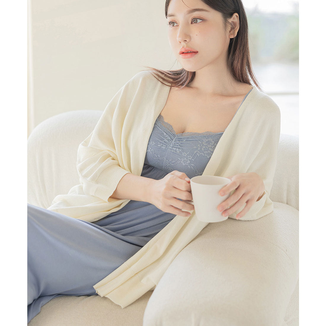 "Tu-Hacci nursing cape cardigan that can also be used as a nursing cover."